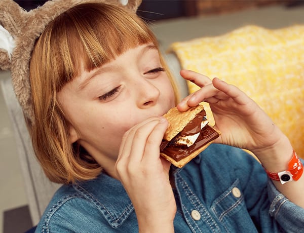 Little girl enjoying a s'more